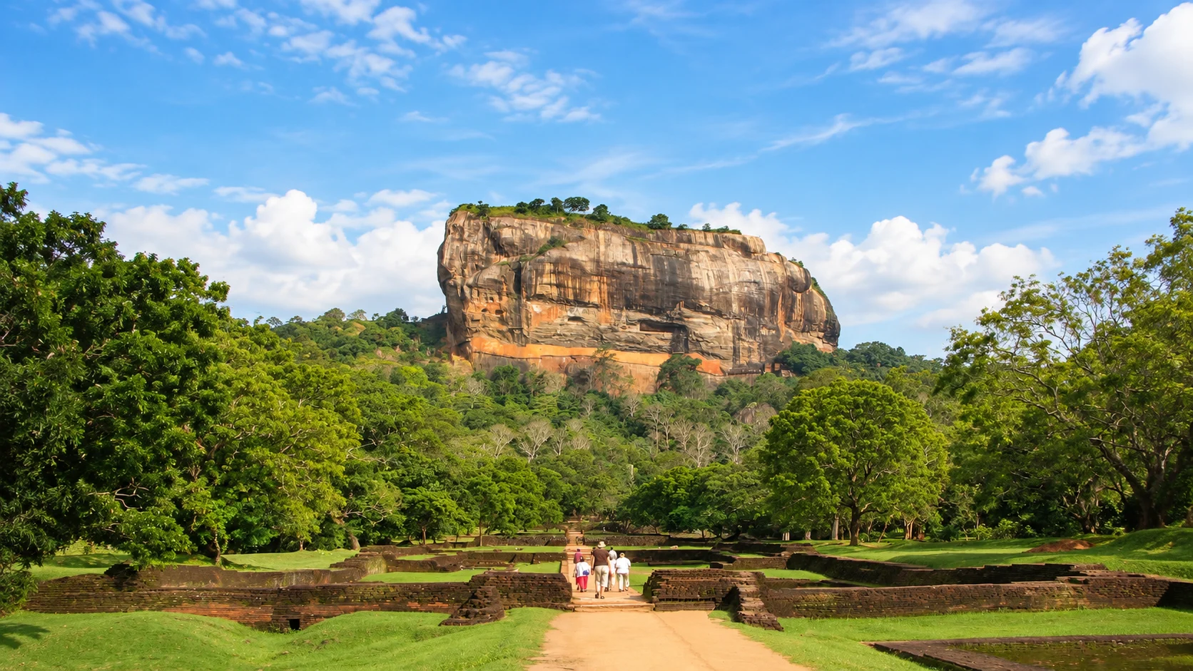 Sigiriya Rock rising above tropical forest